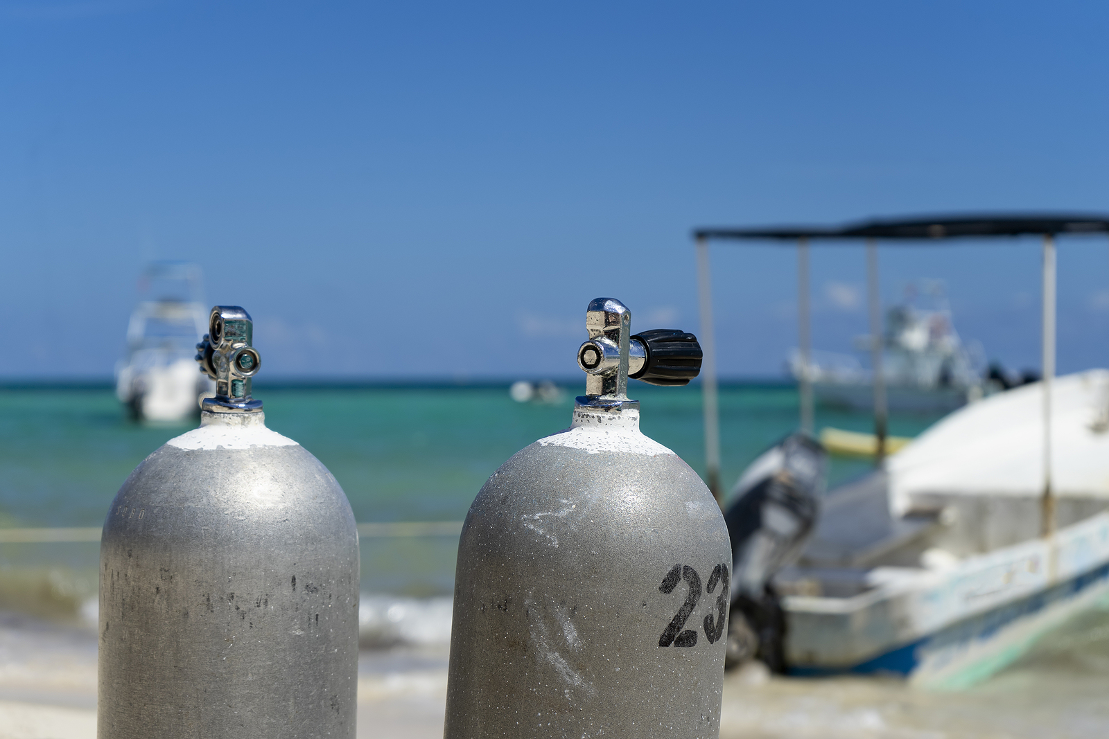 Two scuba diving tanks on a Mexican beach